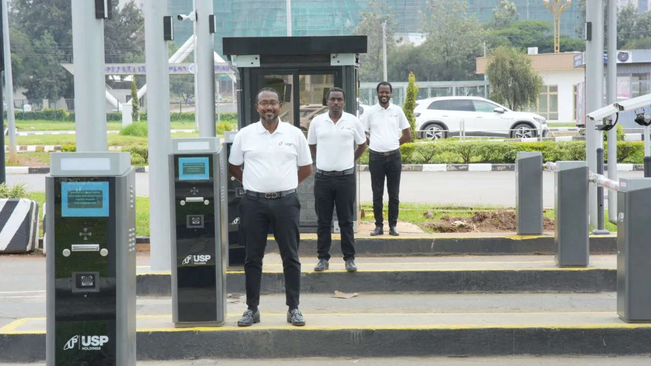 USP Parking team standing among the automated parking entry and exit equipment at Addis Ababa Bole International Airport
