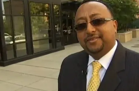 Henok Tesfaye discussing his parking business