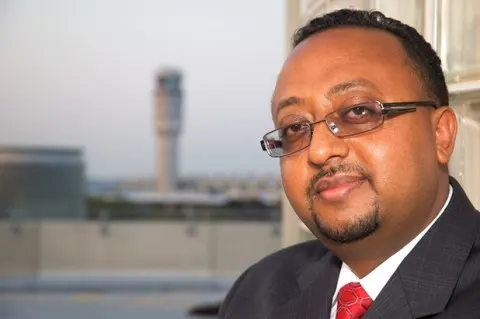 Henok Tesfaye with Reagan National Airport in the background