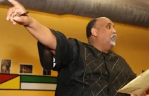 Tamrat Medhin speaking at a community event